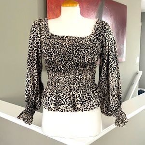Animal print blouse. Brand new. Worn once. Too short in the waist for my liking